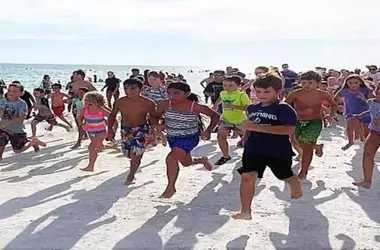 Summer Fun Unleashed: Family Beach Runs Energize Local Communities